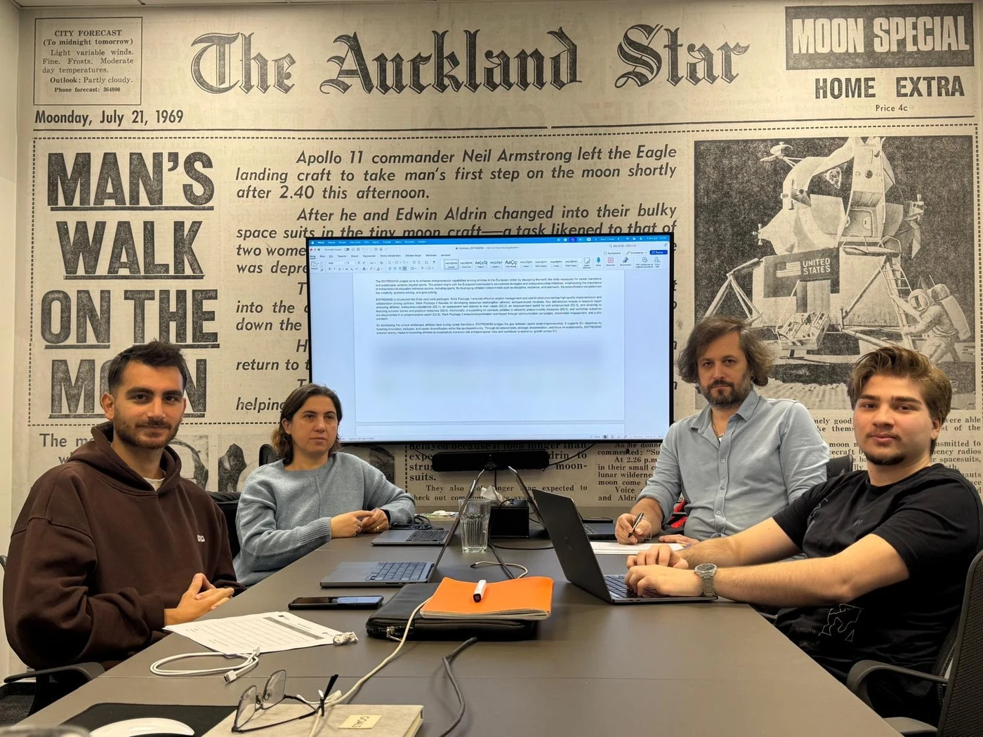Four partner representatives seated around a meeting table at CIC Warsaw during the ENTREMIND kick-off meeting.